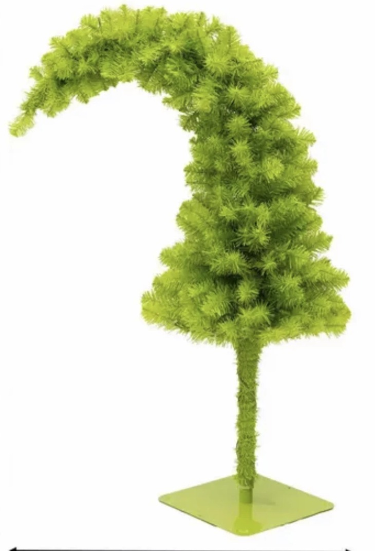 The signature curved lime Grinch tree used across the table centerpieces.